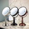 imageOvente 75quot Lighted Tabletop Vanity Makeup Mirror 1X ampamp 7X Magnifier Spinning Double Sided Round LED 3 Tone Smart Touch Auto Shut Off Timer Battery ampamp AC Plug Operated Nickel Brushed MPT75BR1X7XAntique Copper